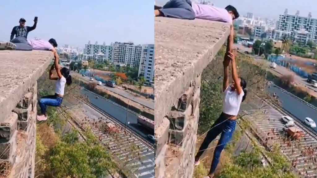 রিলসের জন্য অন্যের হাতে ১০০ ফুট উঁচুতে ঝুলে রইলেন তরুণী